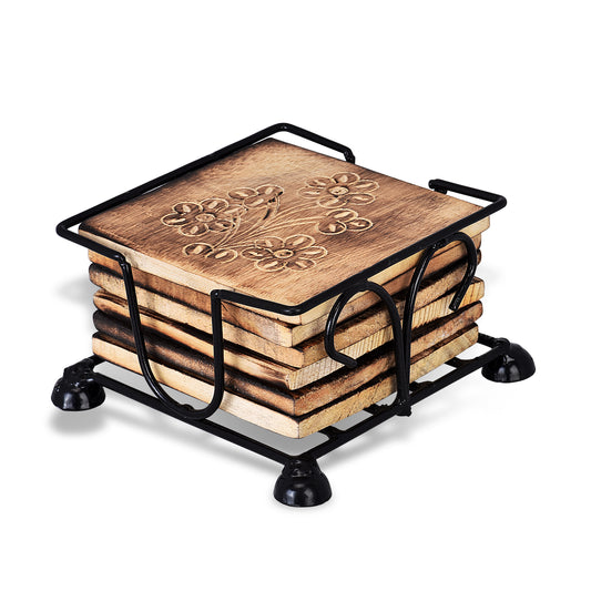 A set of square wooden coasters with floral patterns