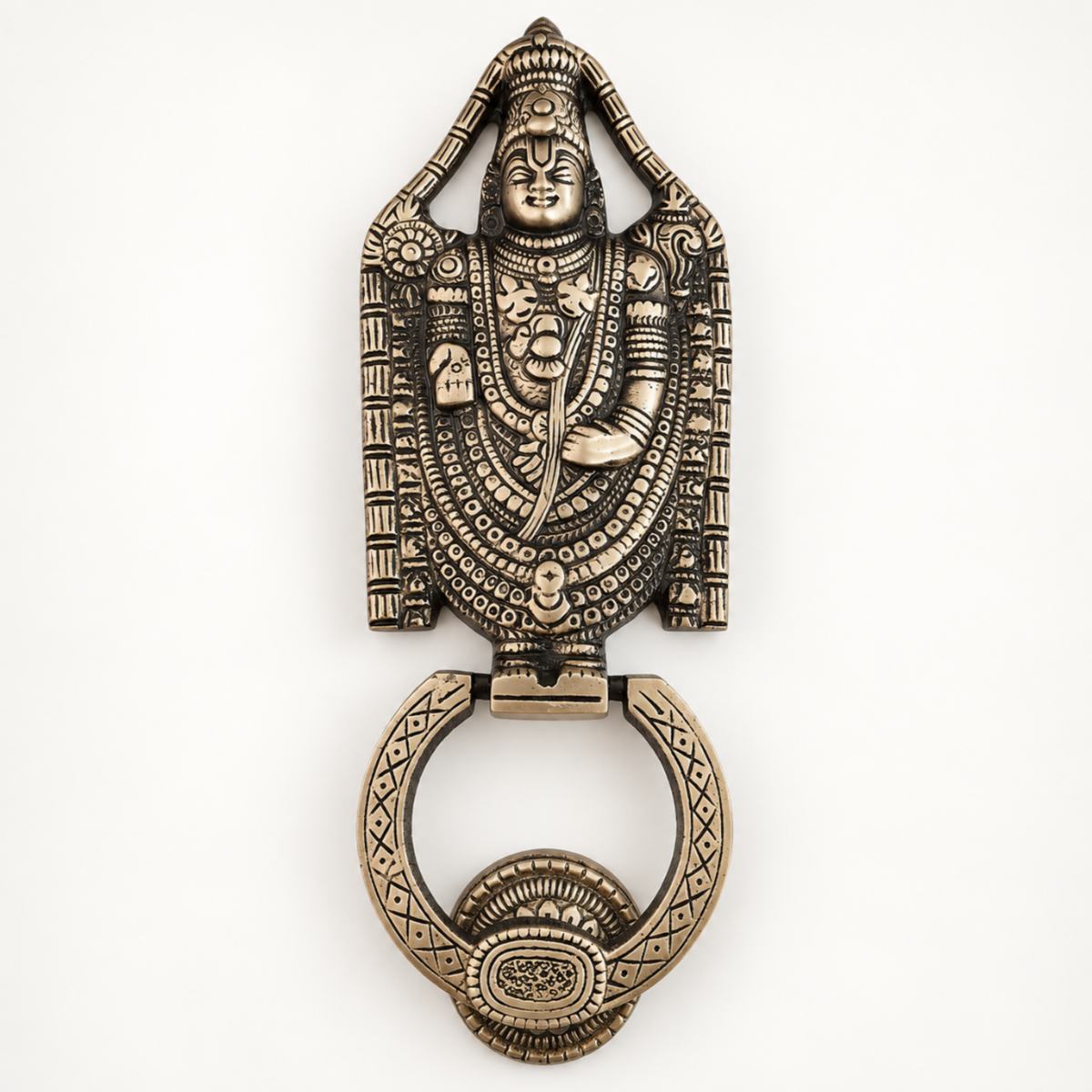 An ornate antique bronze door knocker featuring a detailed relief carving of a Hindu deity, shown on a plain white background.