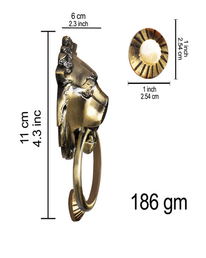 Brass door knocker with measurements on a white background
