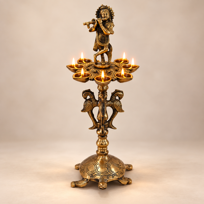 Brass Krishna Diya Stand with 7 Oil Holders – Antique Finish | The Indian Aura