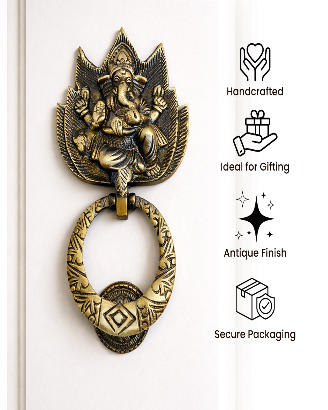 Decorative brass door knocker with Ganesha figure on a white background