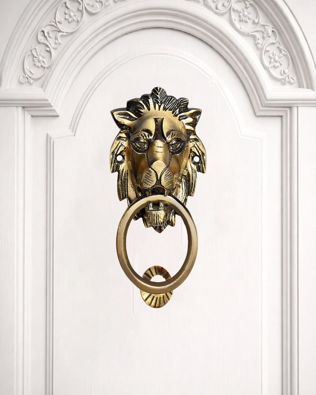 Gold lion-shaped door knocker on a white door