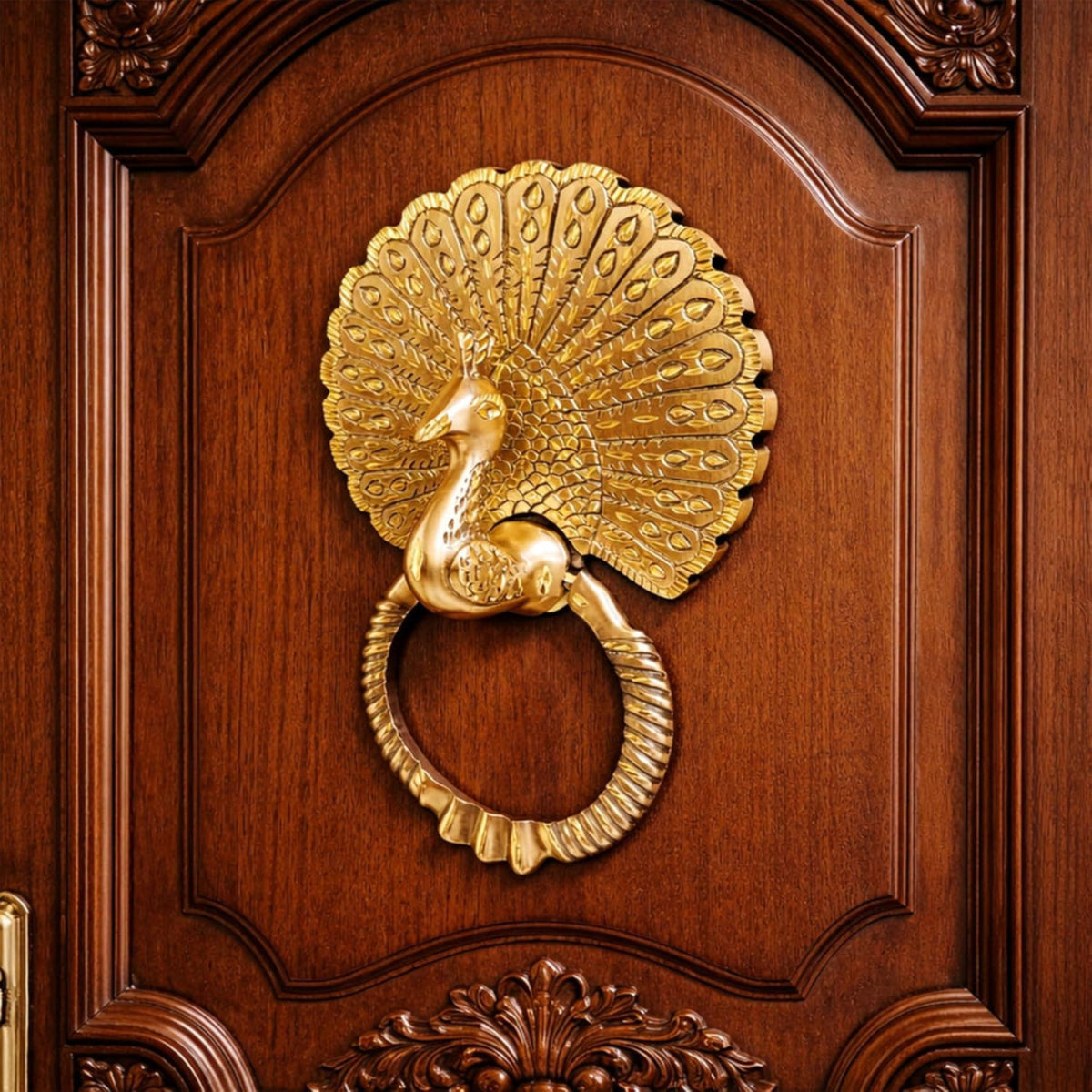 Gold peacock door knocker on a wooden door