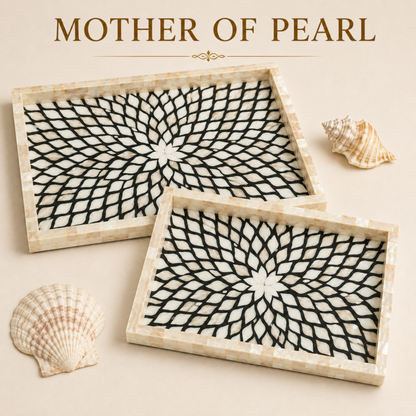 Two rectangular mother-of-pearl trays with a black and white geometric spiral pattern, displayed on a beige background with decorative seashells and the text 'MOTHER OF PEARL' at the top.