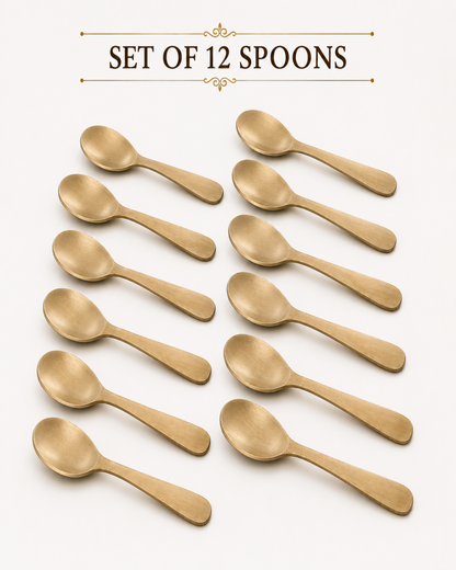 Twelve small gold-toned spoons arranged in two columns on a white background, with the text 'SET OF 12 SPOONES' above them.