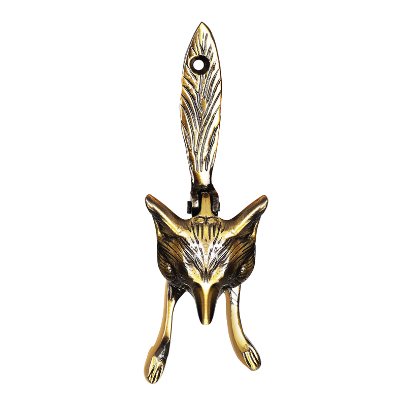 A gold-colored brass door knocker in the shape of a fox's head.