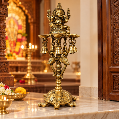Brass Ganesh Diya Stand with 7 Oil Holders | Antique Finish Pooja Lamp with Hanging Bells, Peacock Design & Tortoise Base for Home Temple, Decor & Gifting | The Indian Aura